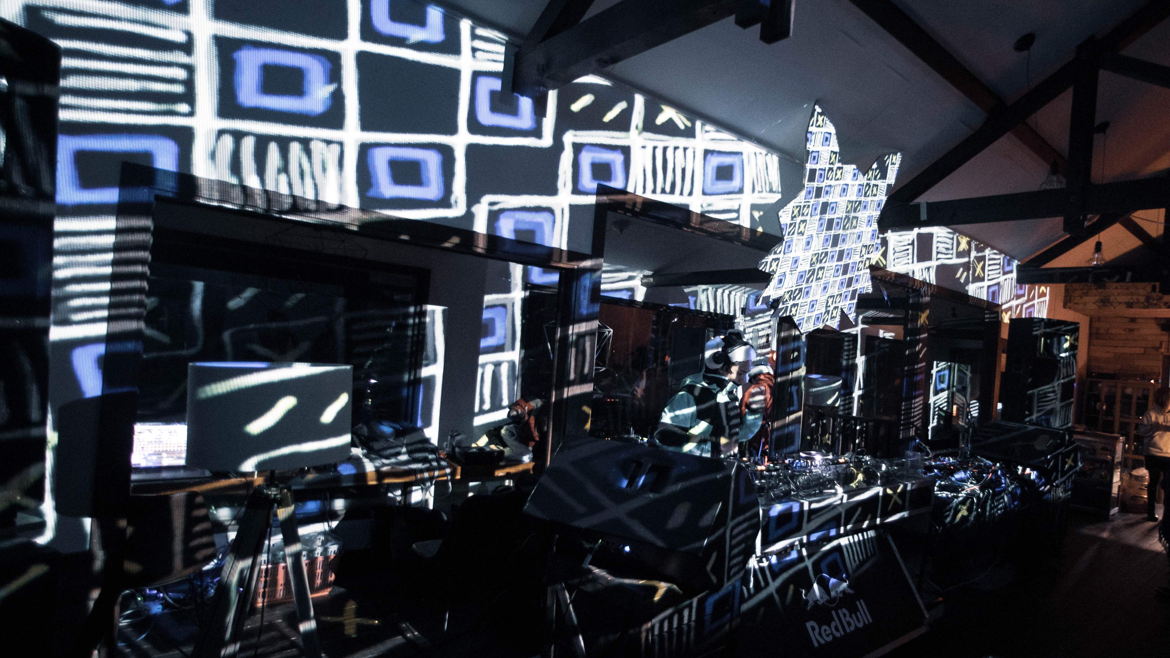 A DJ booth wrapped in projection mapping at Fox in the Box