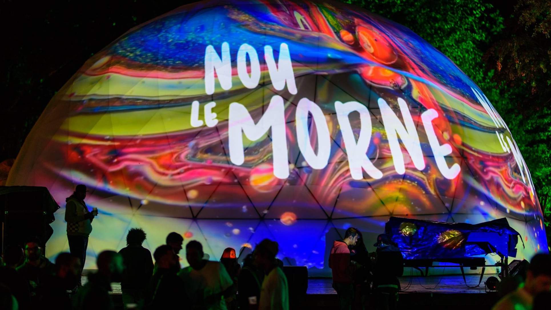 The Nou Le Morne dome covered in projection mapping, a band playing in front